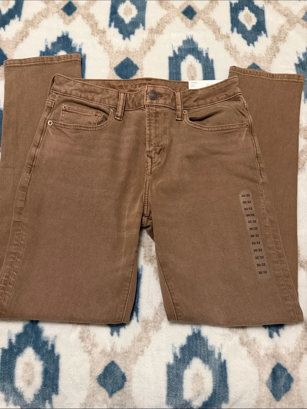 Men’s athletic fit brown jeans.